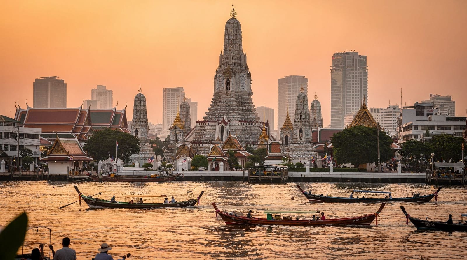 Bangkok — Wat Arun, the Grand Palace and the Chao Phraya river at golden hour